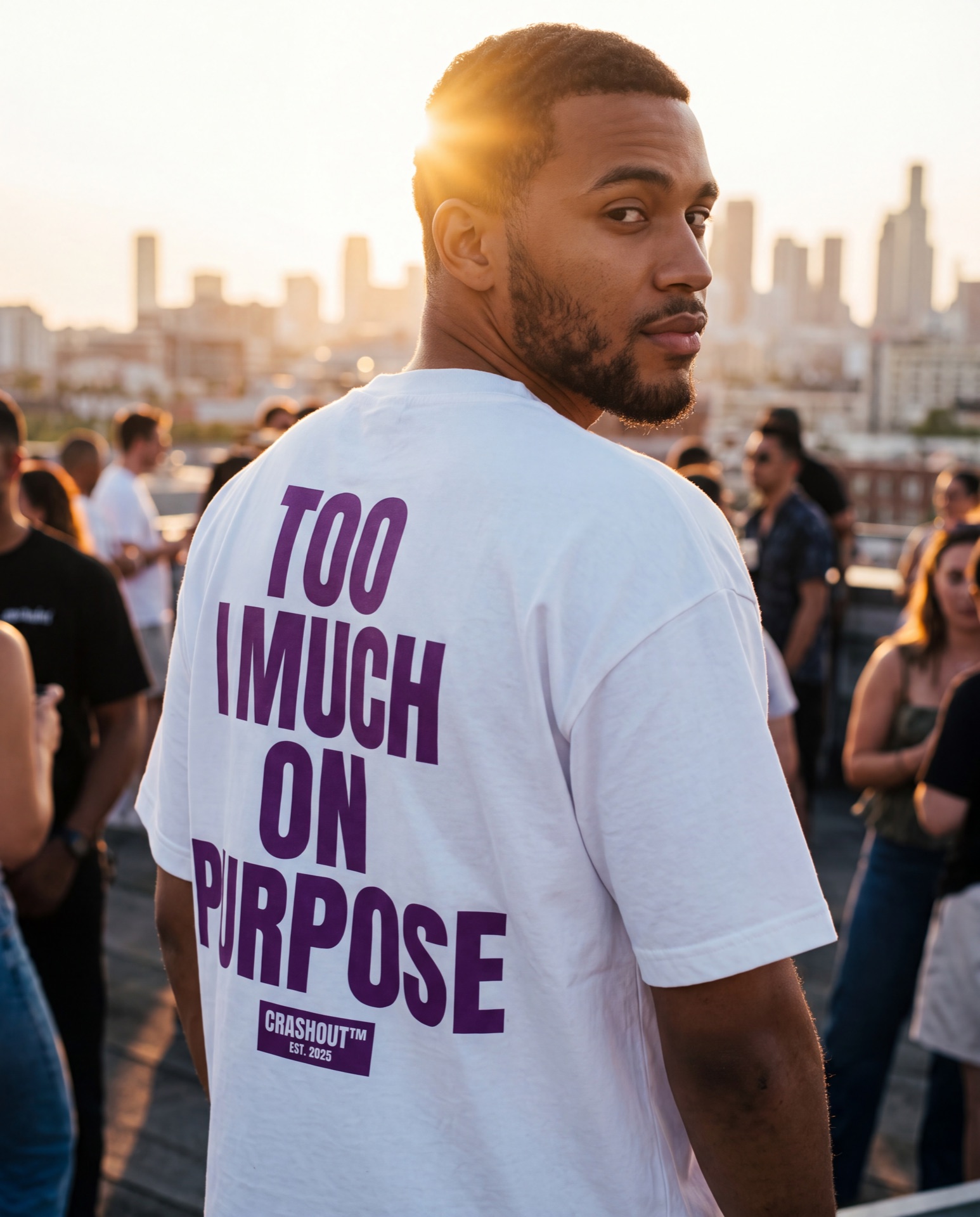 Model on a rooftop at golden hour wearing a Too Much On Purpose tee